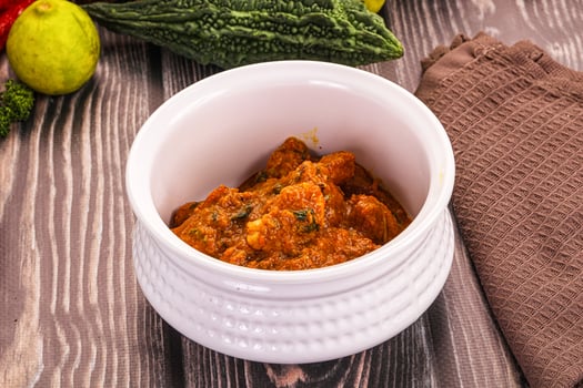 A white bowl filled with food photo