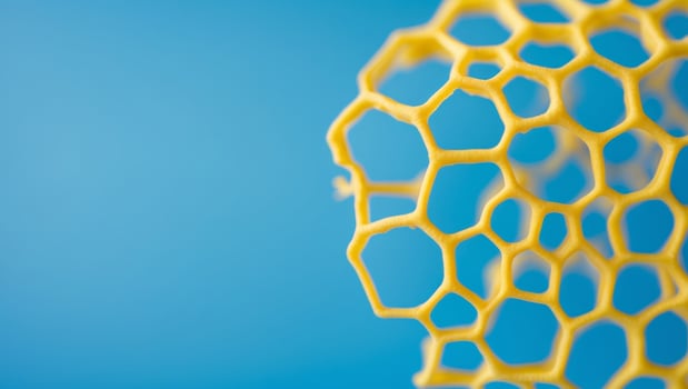 Abstract Yellow Honeycomb Texture on Bright Blue Background photo