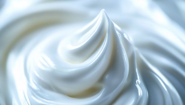 Close-up of creamy, white, swirling texture. photo
