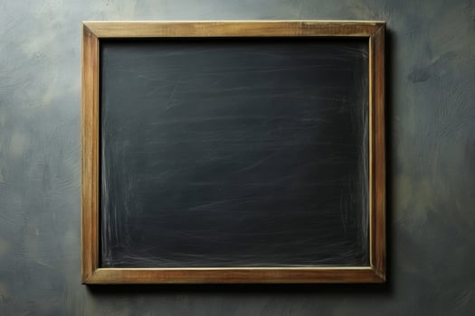 Blank chalkboard in a rustic wooden frame set against a textured wall interior photo