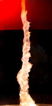 Spiraling Flame Against Dark Background photo