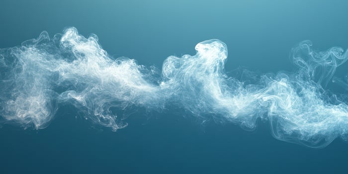 Swirling white smoke against a blue background creates an ethereal and tranquil ambiance photo