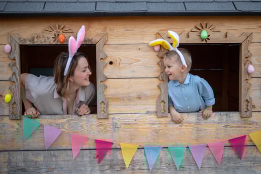 mom and son in bunny ears celebrate easter, play in the playhouse. Happy easter photo