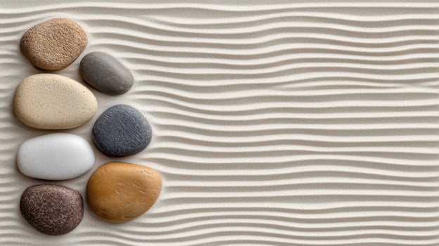 Pebbles on the sand with waves photo
