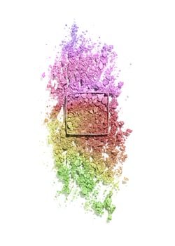 Crushed eye shadow powder cosmetics swatch isolated on white background, green yellow red color gradient. Bright make up powder texture. Broken eye shadow smear. Top view face cosmetic product sample photo