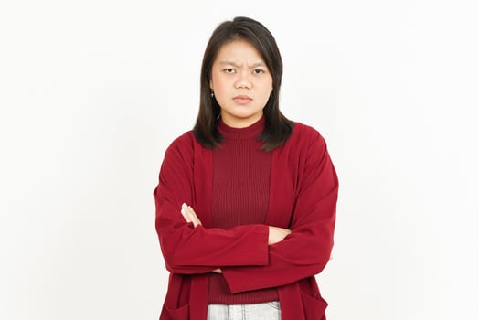 A woman in a red sweater standing with her arms crossed photo