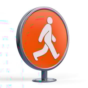 A modern pedestrian sign featuring a white walking figure on a vibrant orange background. photo