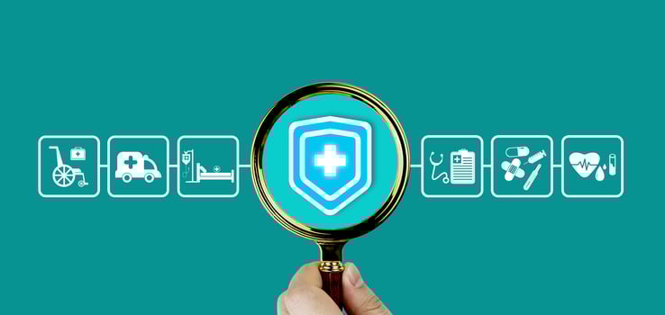Magnifying glass with protective shield and medical icons. Concept of searching for plan health insurance, financial risk protection for medical expenses, and assisting in managing health risks. photo