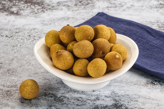 A bowl of kiwi fruit on a table photo