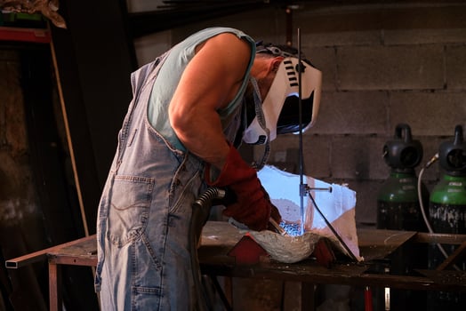Craftsman during process of welding photo