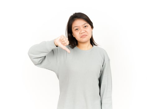 A woman is showing a thumbs down sign photo