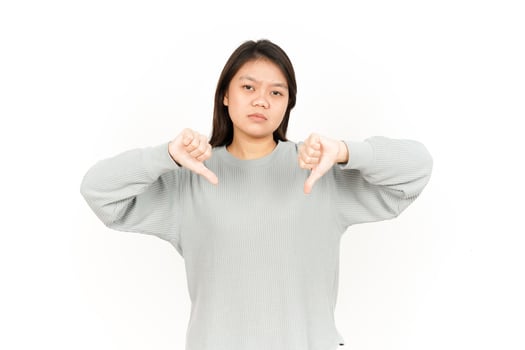 A woman making a thumbs up sign photo