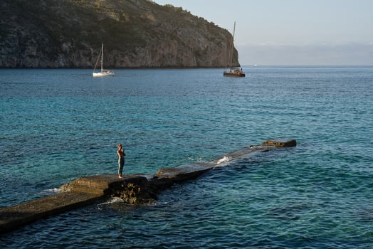 Woman doing yoga on pier photo