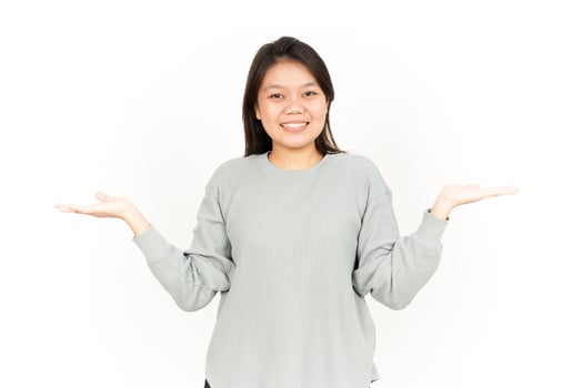A woman is holding up her hands and smiling photo