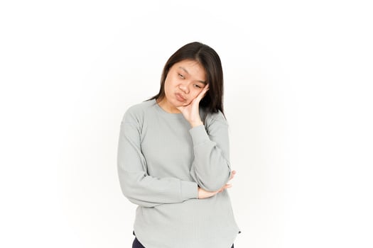 A woman is holding her head in her hands photo