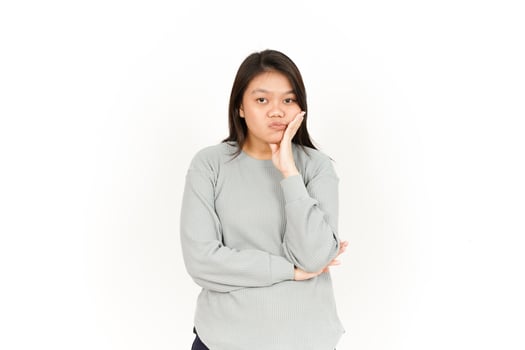A woman in a grey sweatshirt and black pants photo