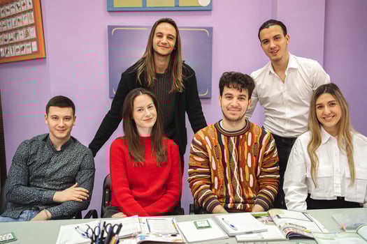 Group of happy students at language school class photo