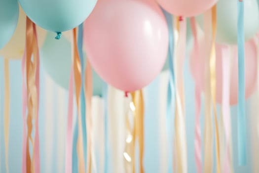 Bright and playful atmosphere featuring multicolored streamers and pastel balloons, creating a festive backdrop perfect for a children's party celebration photo
