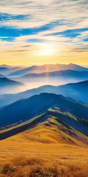 breathtaking landscape showcasing rolling hills and mountains at sunrise, with golden grass and vibrant sky. scene evokes tranquility and natural beauty photo