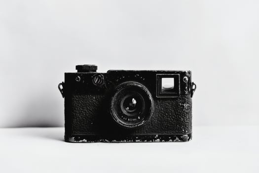 Vintage camera on a plain background photo