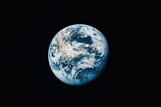 Earth viewed from space against black backdrop photo