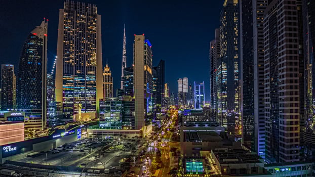 Dubai business district with modern skyscrapers, Burj Khalifa, and highrise buildings at dusk 1 photo