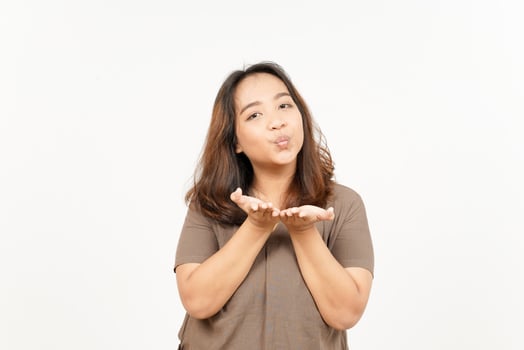 A woman blowing a kiss on a white background photo