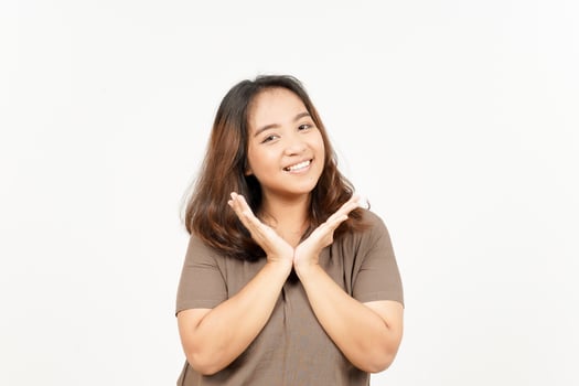 A woman is smiling and making a gesture with her hands photo