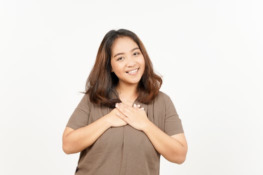 Asian woman smiling with hands on chest photo