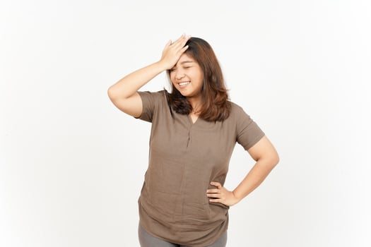 A woman is holding her head in her hands photo