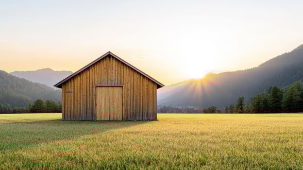 A small wooden house sits in the middle of a field photo