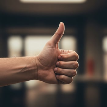 A person giving the thumbs up sign photo