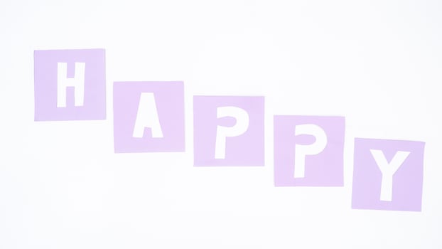 HAPPY spelled with alphabet shaped purple paper cut isolated on white background photo