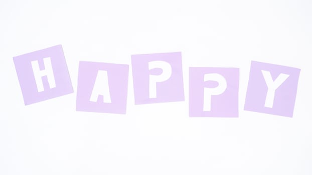Alphabet shaped purple paper cut formed word HAPPY isolated on white background photo