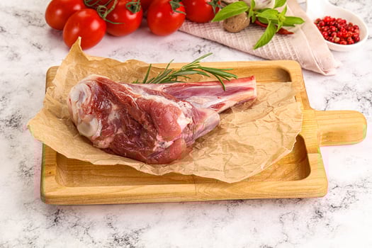 A piece of meat on a cutting board photo