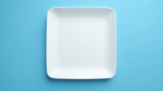 Empty white square plate on blue background. Minimalist tableware, dining, kitchen, food presentation, and restaurant concept photo