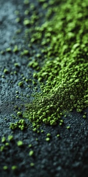 Moringa powder scattered on a dark surface highlighting its color photo