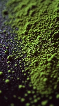 Vibrant green moringa powder on a dark surface photo