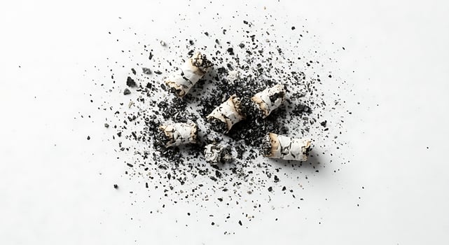 Crushed Cigarette Butts Ash Scattered White Background end grey life quit stop dark mess dust grit photo