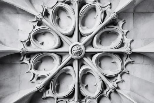 Gothic architectural detail showing intricate stone carving in a church ceiling photo