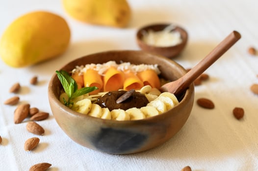 Bowl with appetizing fruits and nuts photo