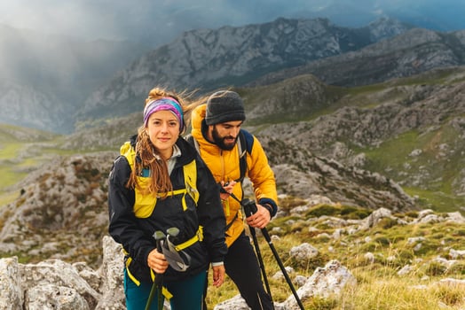 people trekking in the mountains with breathtaking views photo