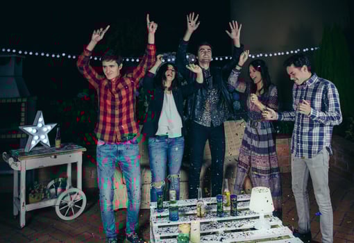 Happy friends dancing and having fun in a party photo