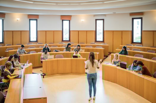 Teacher giving assignment to students photo