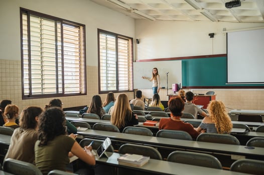 Lecturer talking to students during lesson photo