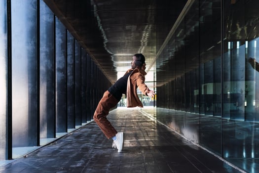 Black man dancing while listening to music photo