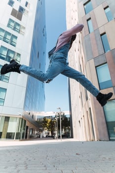 Excited black man enjoying music in city photo