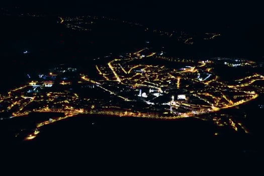 Glowing lights of city at night photo