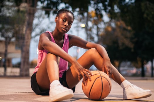 Confident female basketball player on the court photo