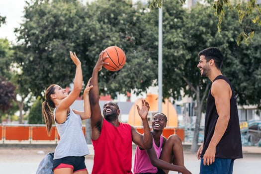 United on the Court Friends Enjoying Basketball Together. Sports concept photo